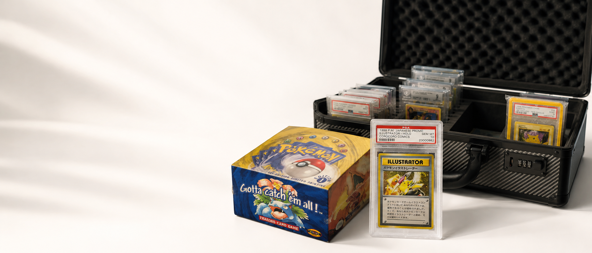 Vintage first edition Pokémon booster box, PSA Illustrator card and open graded-card case